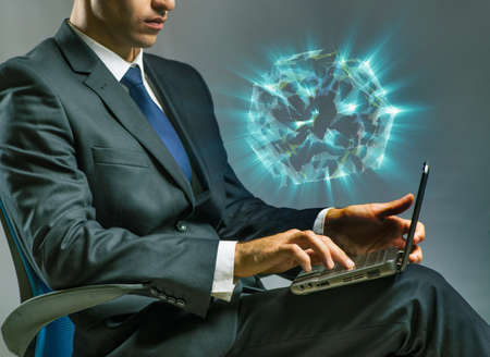 Businessman working on laptop in business conceptの写真素材