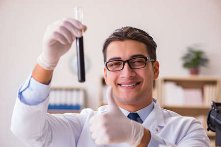 Young lab assistan working in the laboratoryの写真素材