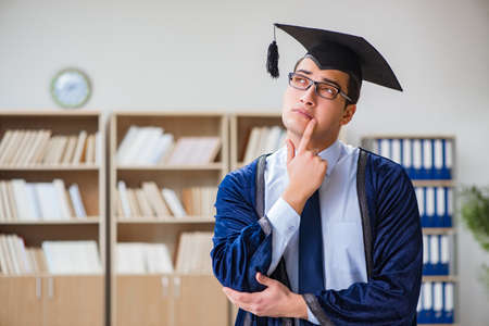 Young man graduating from universityの写真素材