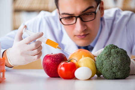 Man doctor checking the fruits and vegetablesの写真素材
