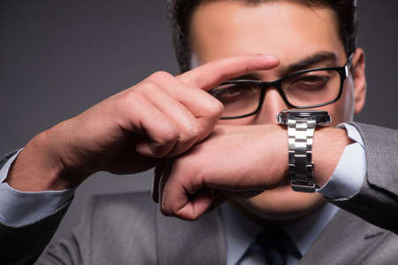 Businessman in time management conceptの写真素材