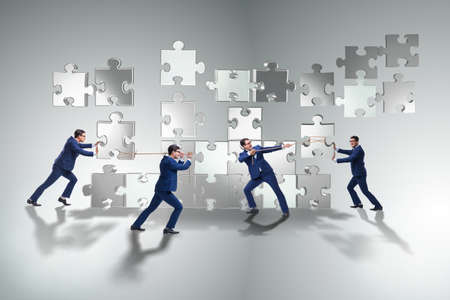 Business concept of teamwork with puzzle piecesの写真素材