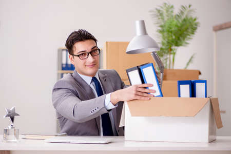 Businessman moving offices after promotionの写真素材