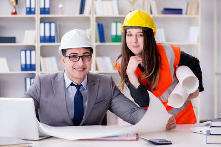 Construction foreman supervisor reviewing drawingsの写真素材