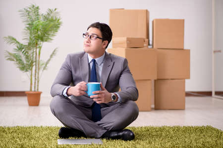 Businessman sitting on the carpet in office