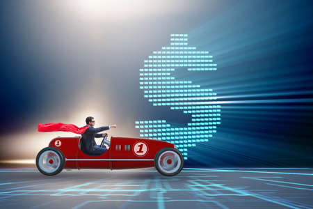 Superhero businessman driving vintage roadsterの写真素材