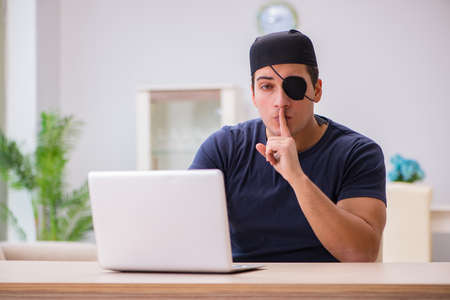 Digital security concept with pirate at computerの写真素材