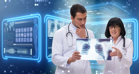 Two doctors looking at x-ray image