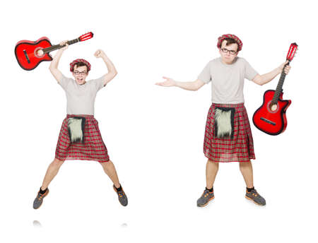 Scotsman playing guitar isolated on whiteの写真素材