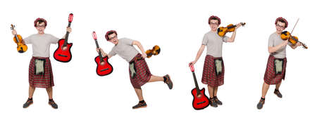 Funny scotsman with musical instrument isolated on whiteの写真素材