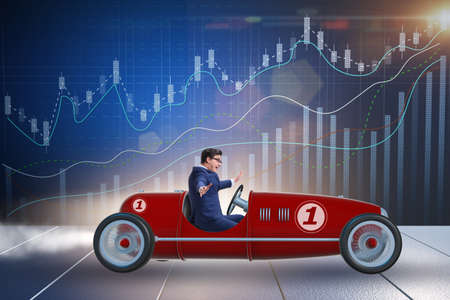 Businessman driving car in financial conceptの写真素材