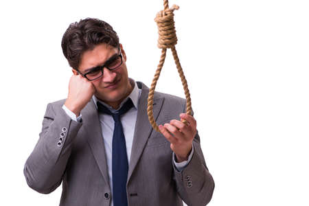 Concept of overworked businessman contemplating and holding onto nooseの写真素材