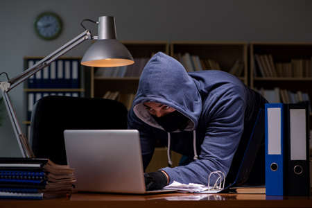 Hacker stealing personal data from home computer