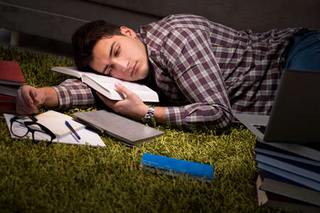 Student reading books preparing for examsの写真素材