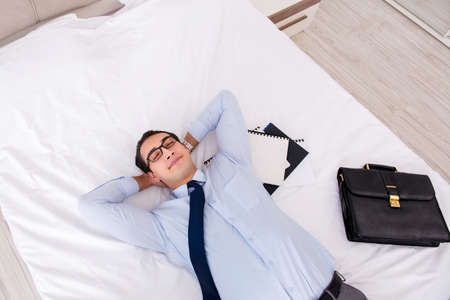 Businessman working in hotel roomの写真素材