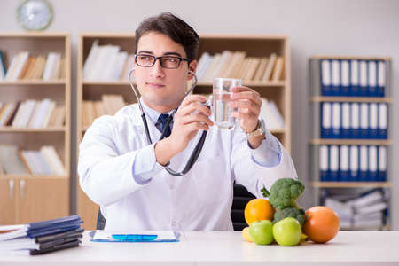 Doctor checking the quality of the waterの写真素材