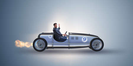 Businessman riding vintage roadster in motivation conceptの写真素材