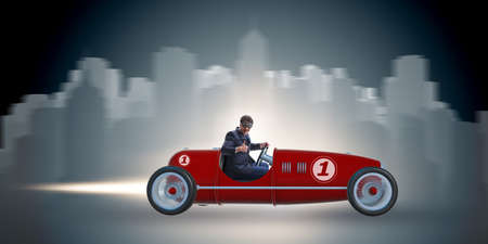 Businessman riding vintage roadster in motivation conceptの写真素材