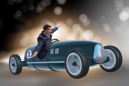 Businessman riding vintage roadster in motivation concept