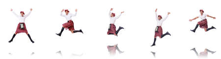 Scottish man dancing on whiteの写真素材