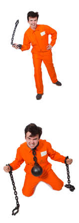 Young inmate with chains isolated on the whiteの写真素材