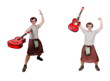 Scotsman playing guitar isolated on whiteの写真素材