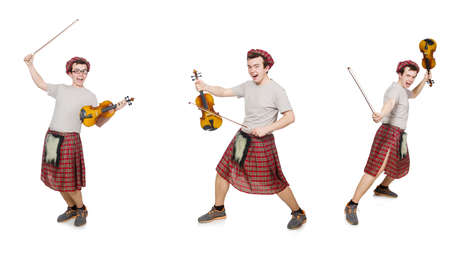 Funny scotsman with musical instrument isolated on whiteの写真素材