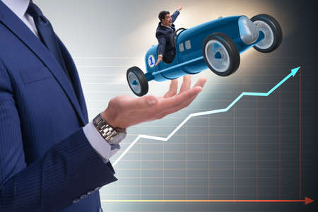 Man launching race car in start conceptの写真素材