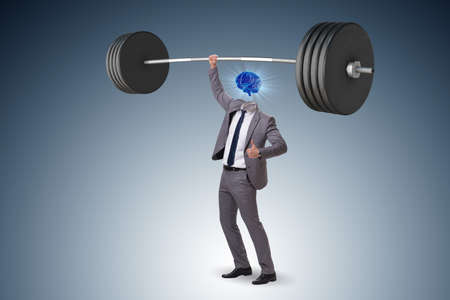 Concept with brain man and dumbbellの写真素材