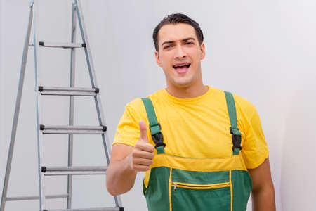 Repairman in coveralls in DIY concept