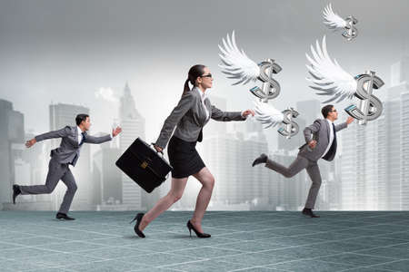 Businesspeople chasing angel investor fundingの写真素材
