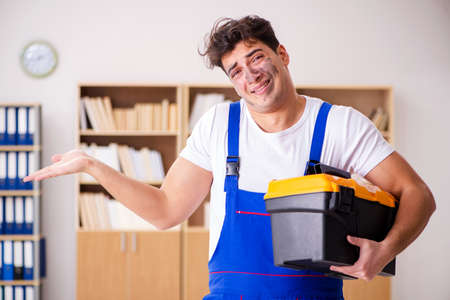 Funny Man doing electrical repairs at homeの写真素材