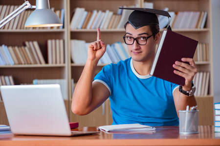 Young man graduating from universityの写真素材