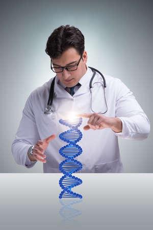 Young studentresearcher studying dna structureの写真素材