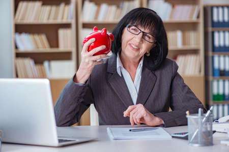 Mature businesswoman working in the officeの写真素材