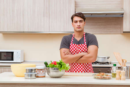 Man male cook preparing food in kitchenの写真素材