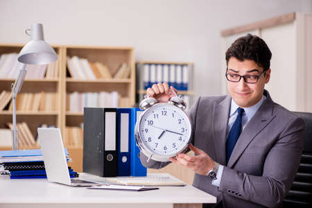 Businessman failing to meet the deadlinesの写真素材