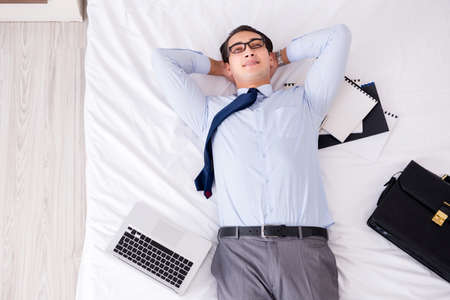 Businessman working in hotel roomの写真素材