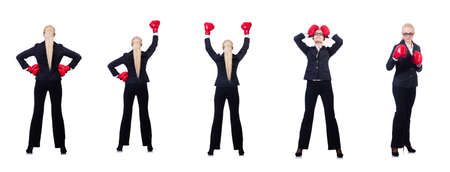 Woman businesswoman with boxing gloves on whiteの写真素材