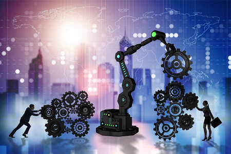 Businesspeople with cogwheel and robotic armの写真素材