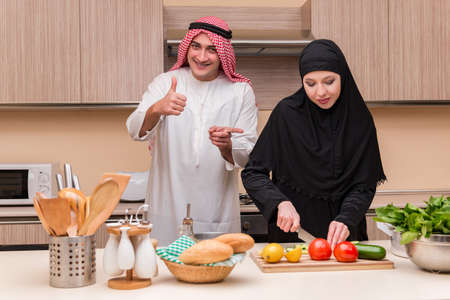 Young arab family in the kitchenの写真素材