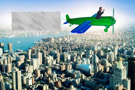 Old vintage airplane with banner ribbonの写真素材