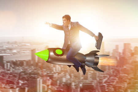 Male businessman flying on rocket in business concept
