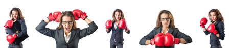 Young woman with boxing gloves isolated on whiteの写真素材