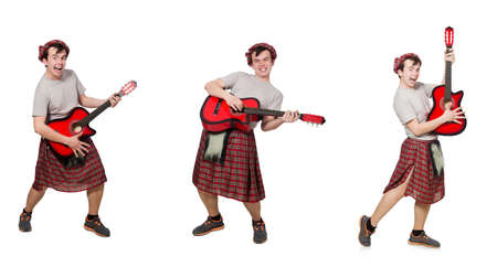 Scotsman playing guitar isolated on whiteの写真素材