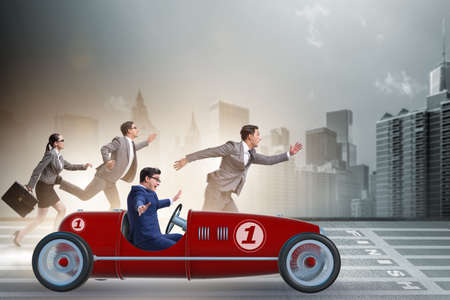 Businessman driving car in competition conceptの写真素材