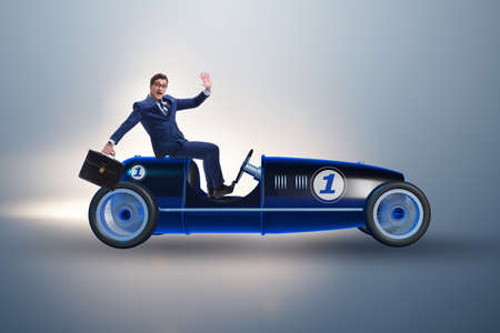 Businessman driving car in competition conceptの写真素材