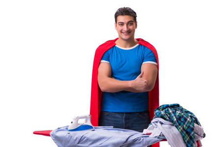 Super hero man husband ironing isolated on whiteの写真素材