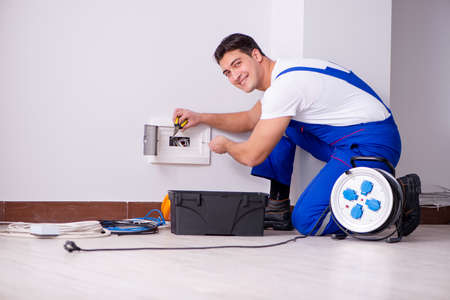 Man doing electrical repairs at home