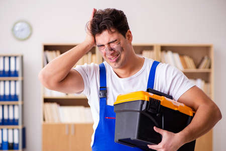 Funny Man doing electrical repairs at homeの写真素材